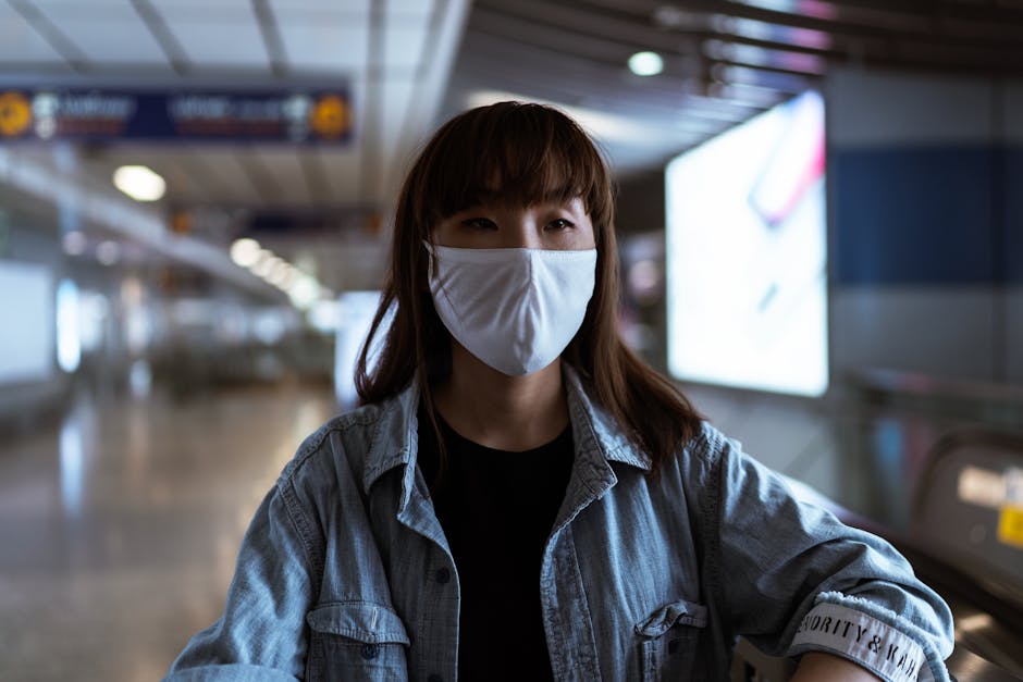 Woman wearing safety mask in modern transit station